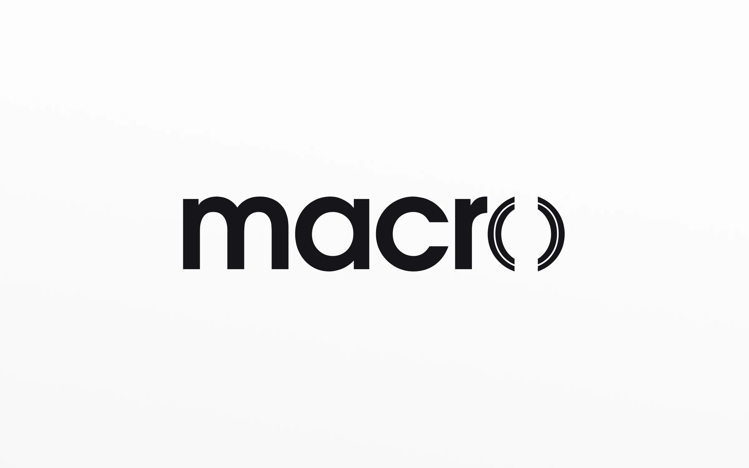 The Macro wordmark in black on white, with its parenthesis mark